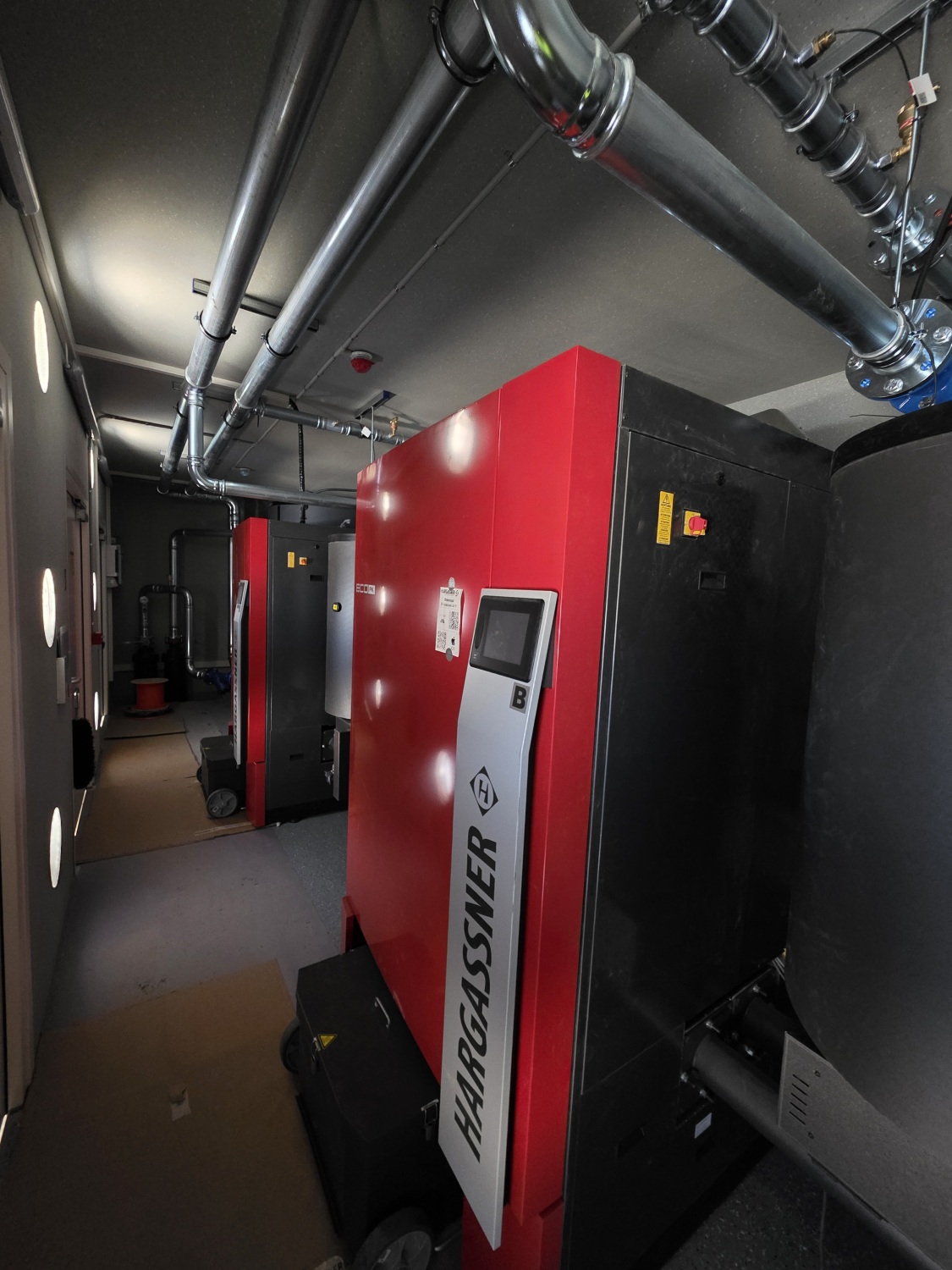 Interior of biomass boiler module with pipework